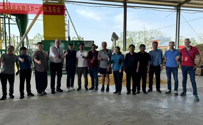 Group photo taken at the site of the corn flaking mills